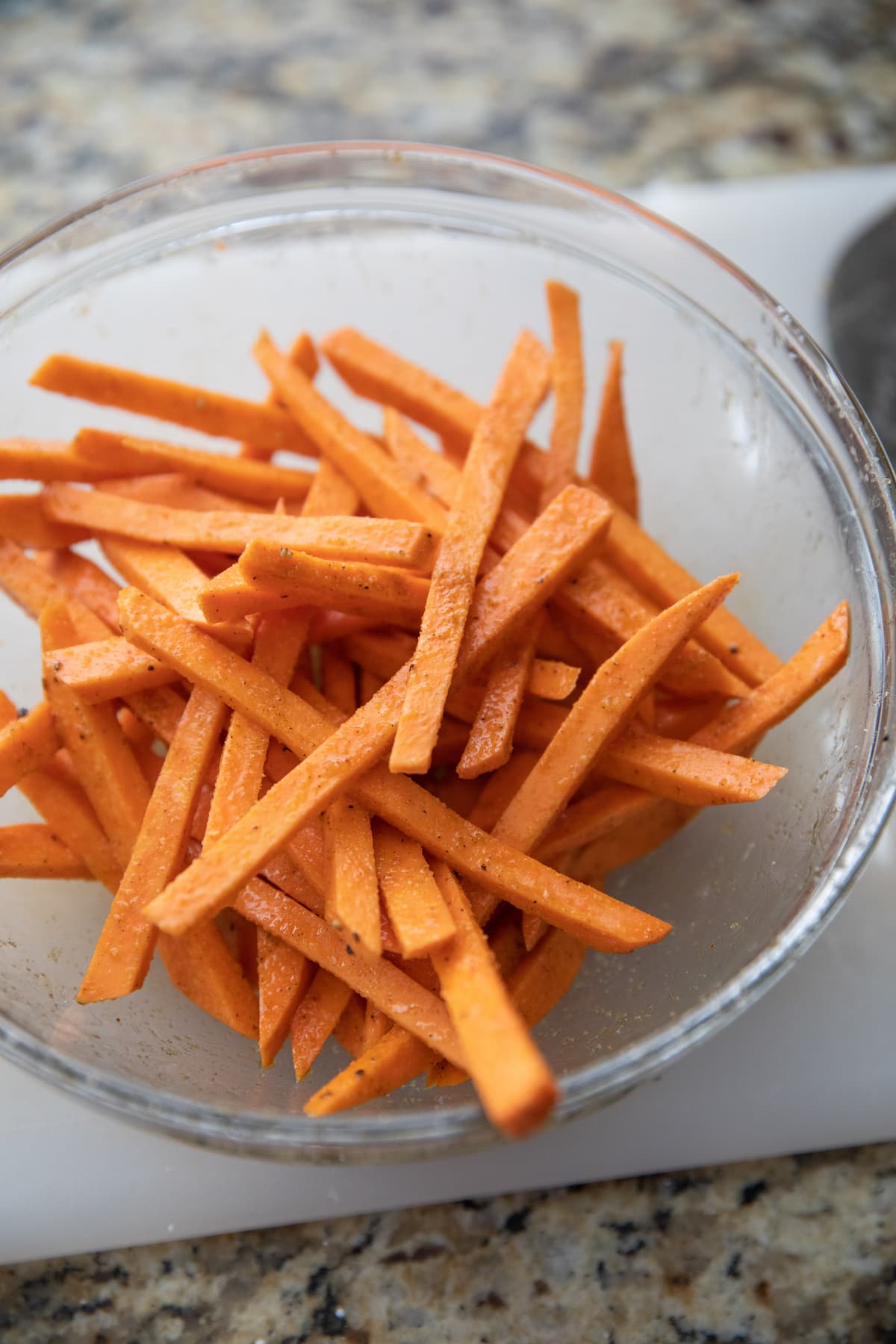 unbaked sweet potato fries in bowl