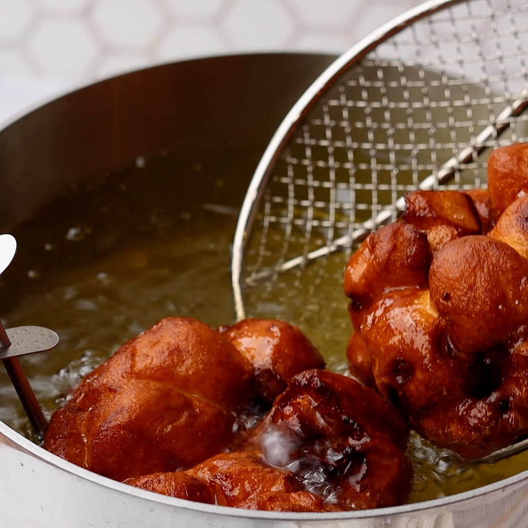 cooked Apple Fritters in fryer