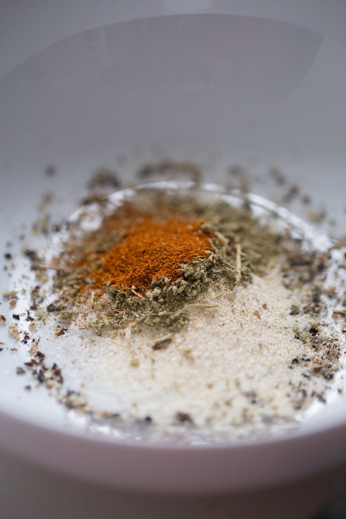 salt, pepper and spices in white bowl