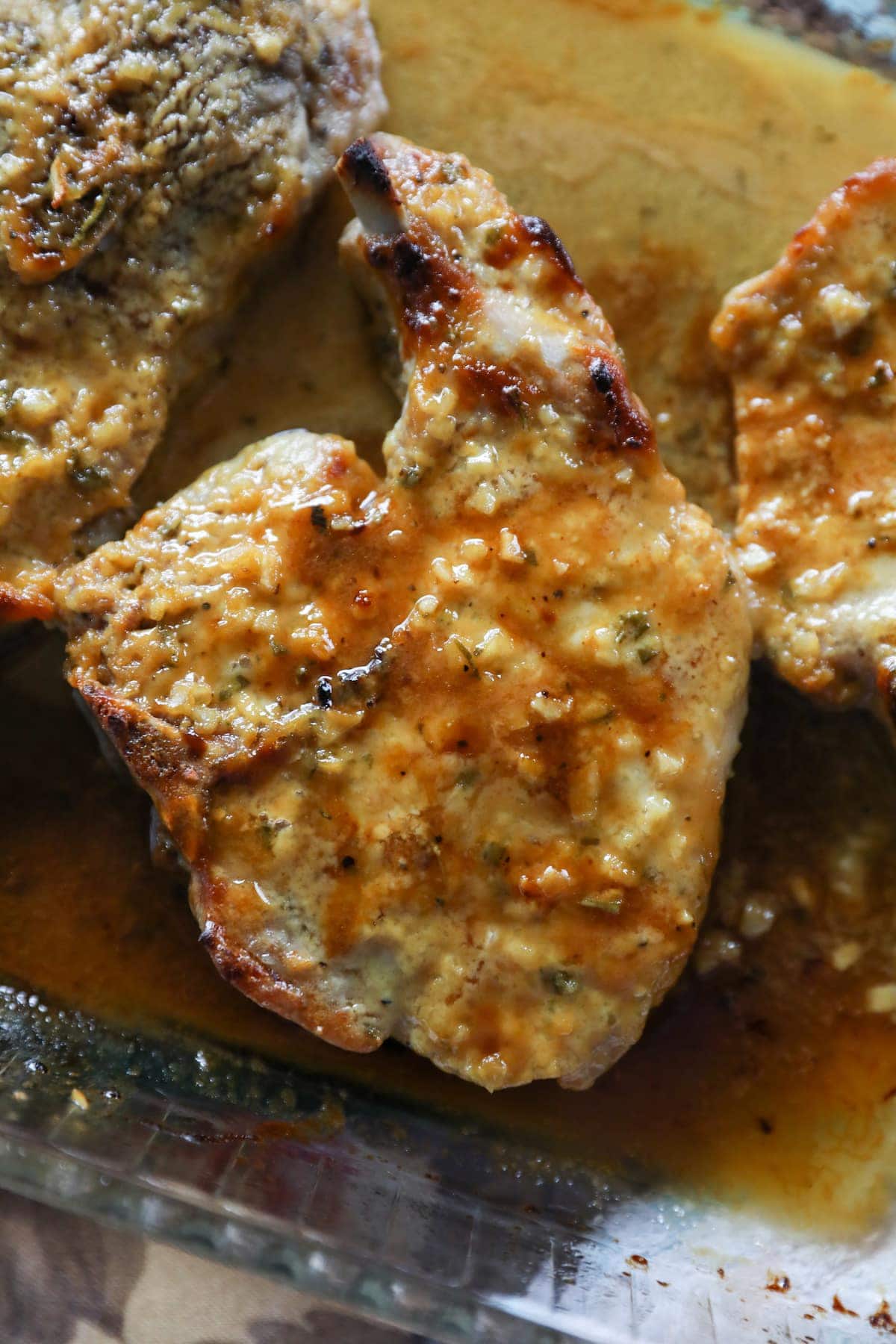smothered baked pork chops in baking dish
