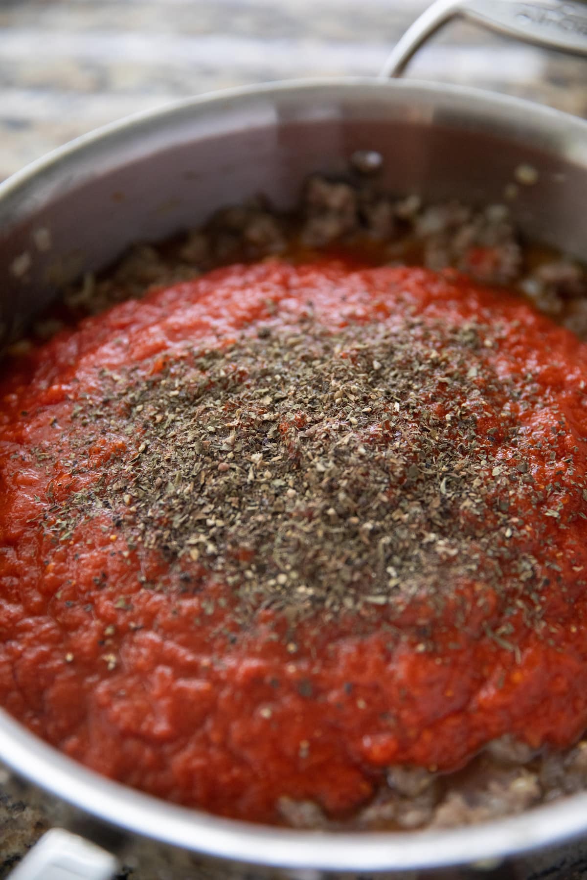 marinara, tomatoes and spices added to deep skillet