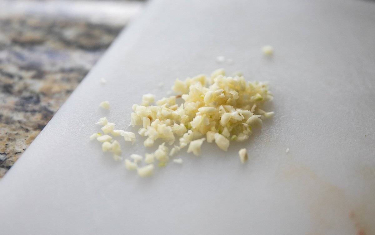 chopped garlic on cutting board