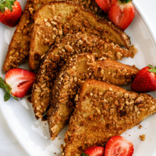sliced Cinnamon Toast Crunch encrusted French toast with strawberries