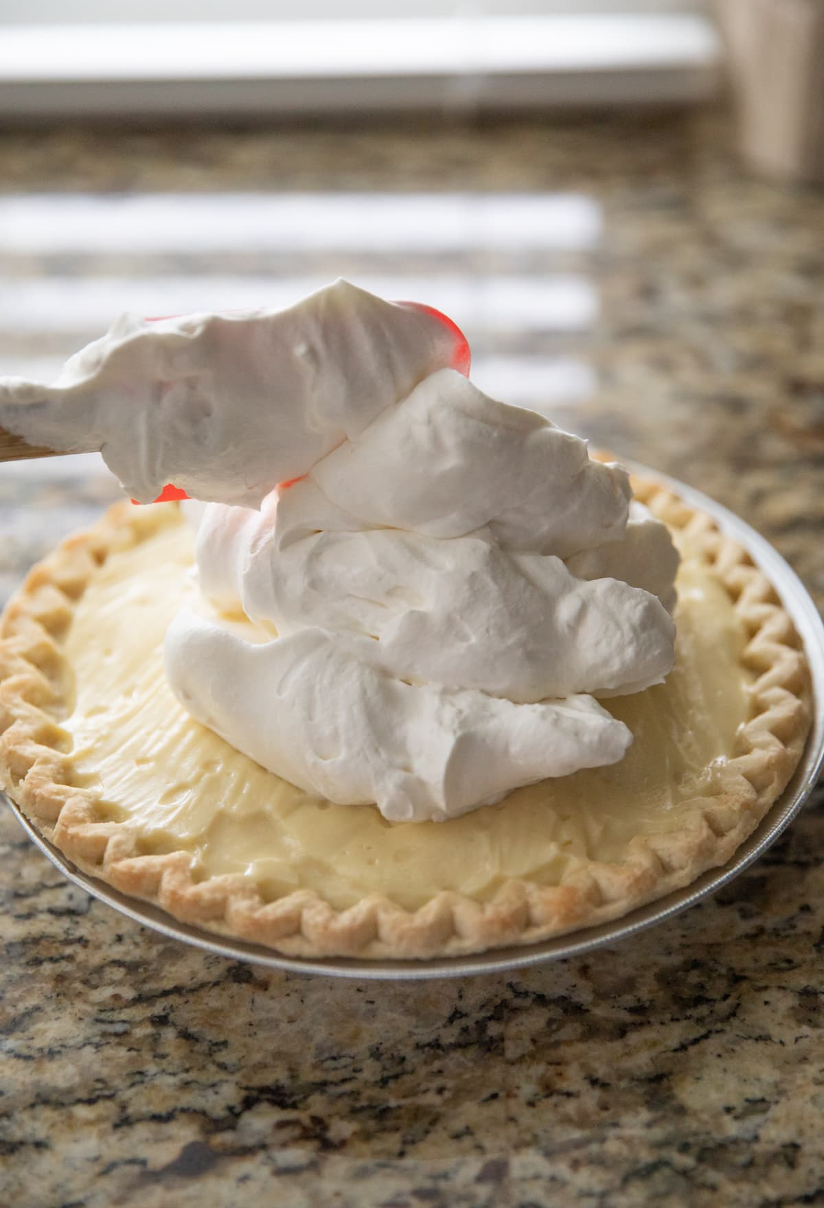 adding cream to top of pie