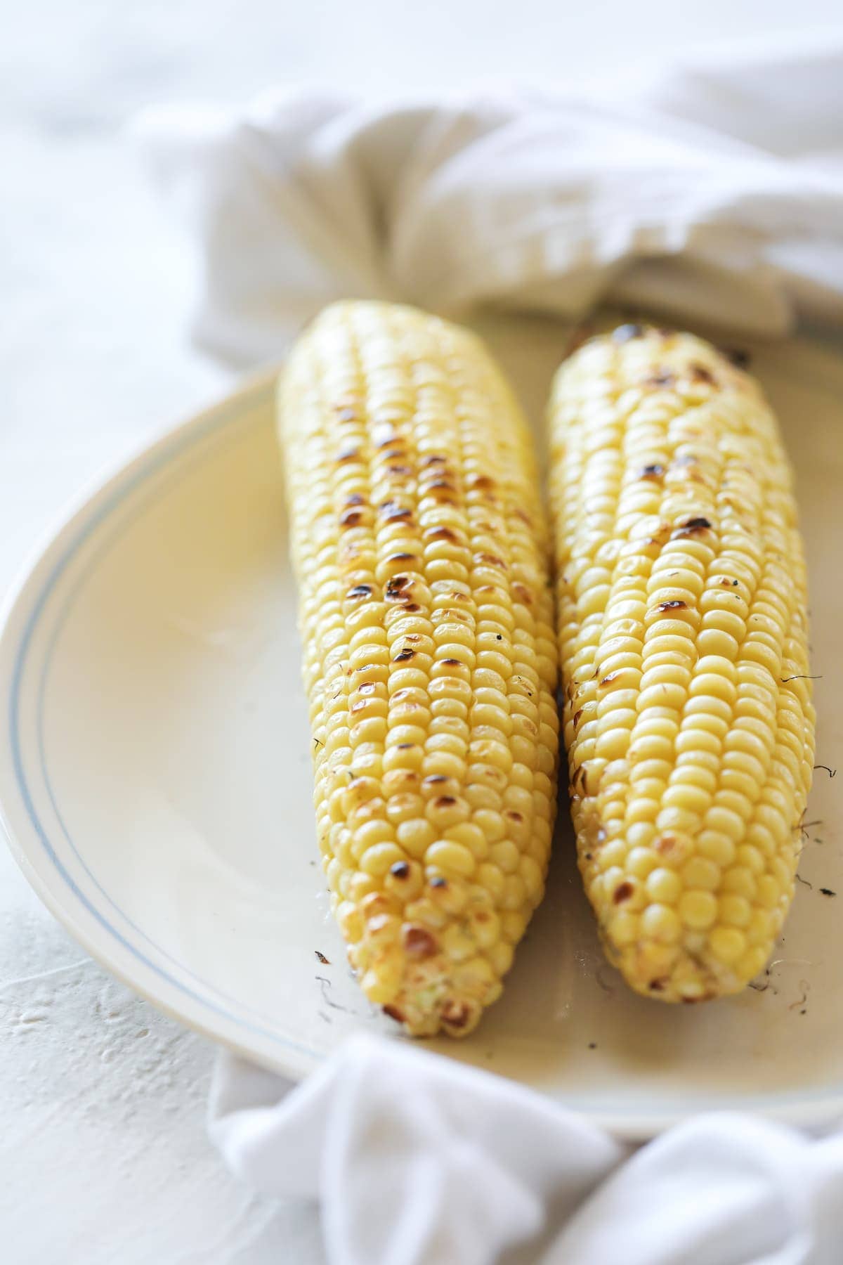 grilled corn on plate