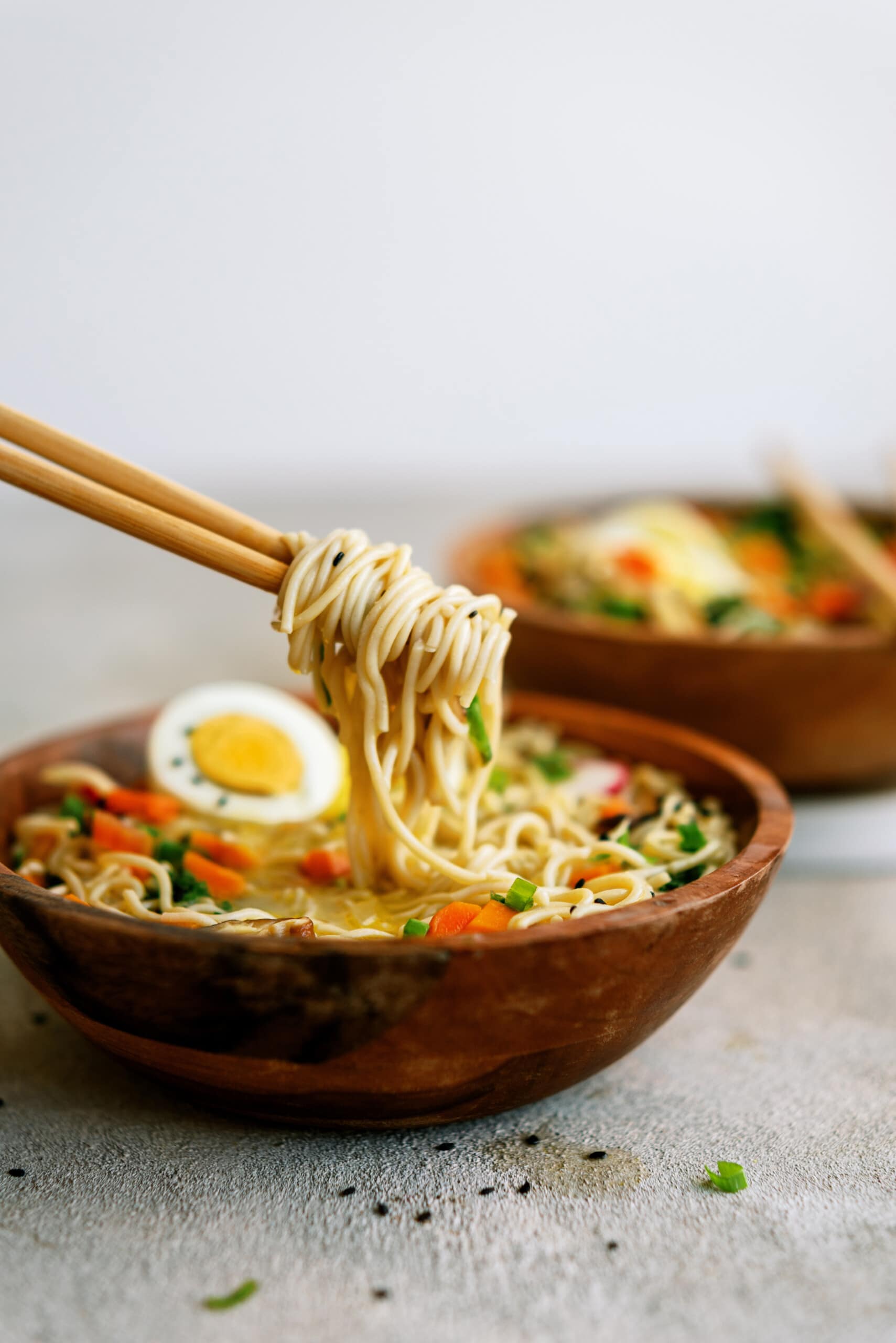 Homemade Ramen Bowl with chopsticks twirling noodles