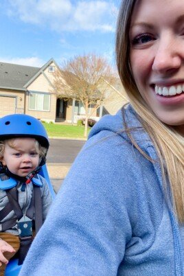 mom on bike with baby in bike seat