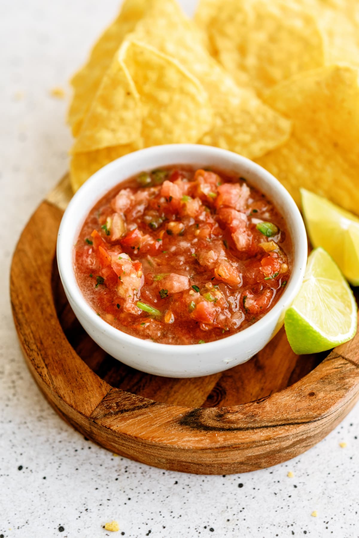 fresh-salsa with chips and lime on cutting board