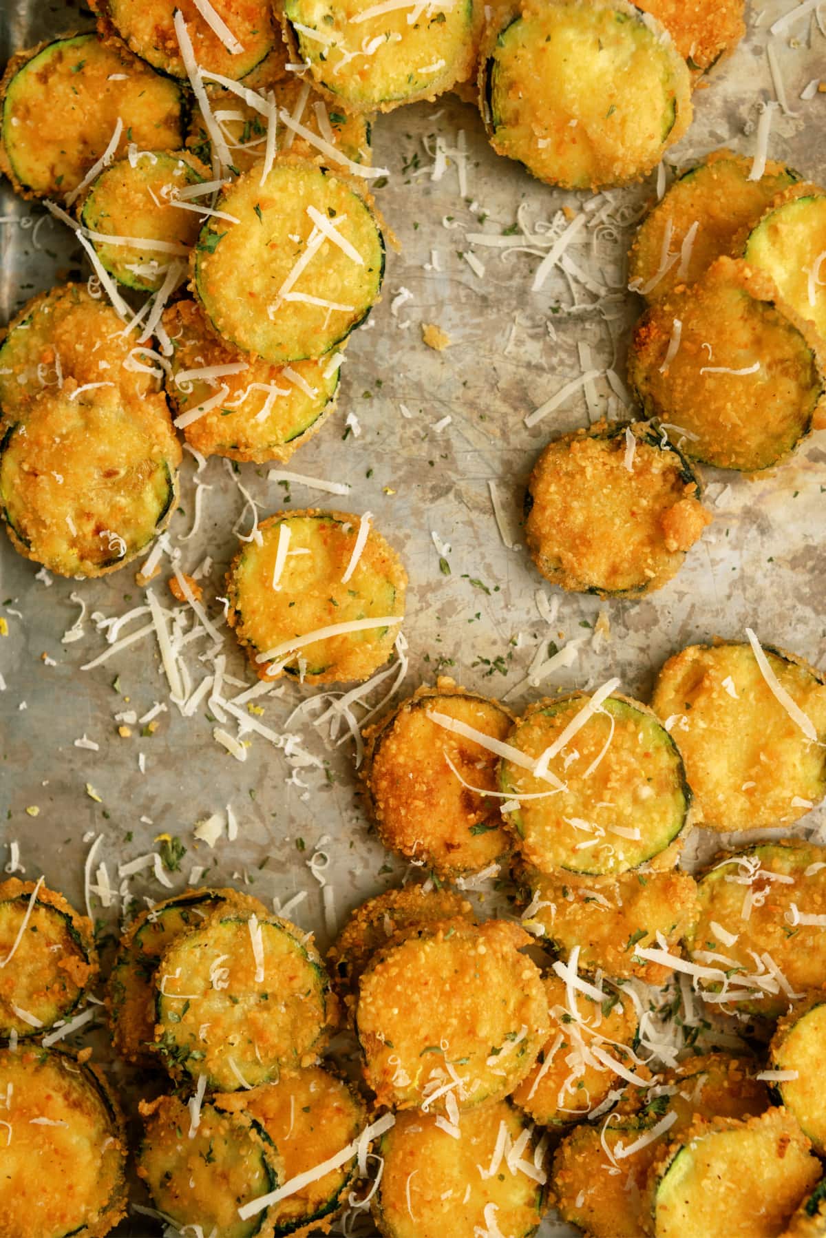 fried zucchini with sprinkled parmesan cheese