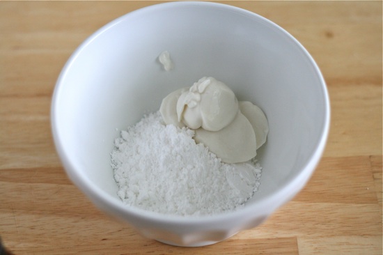 Greek yogurt and powdered sugar in a bowl