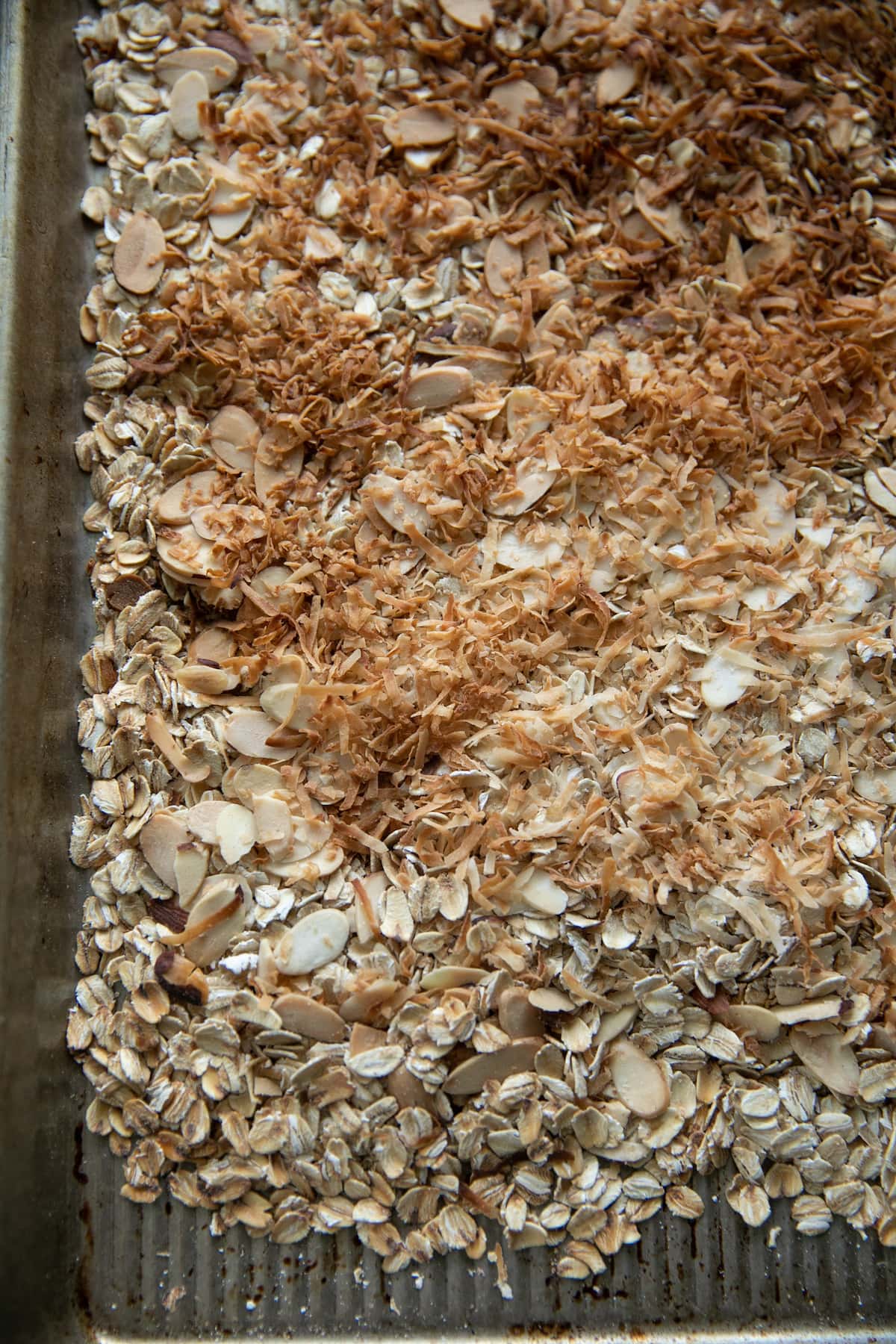 toasted coconut on top of other granola ingredients