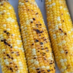 three ears of grilled corn