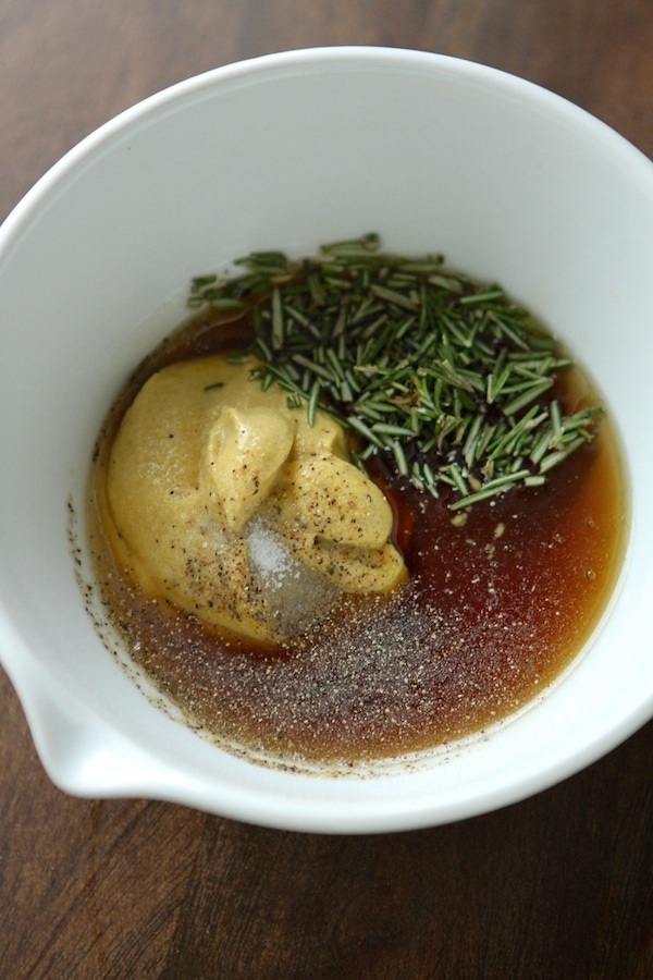 Rosemary, maple, mustard salt and pepper in a bowl