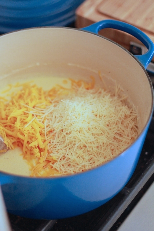Making a cheese sauce in a blue pot