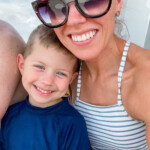 mom with sunglasses smiling with boy