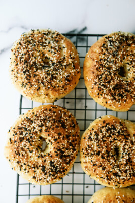 bagels with everything seasoning on a cooling wrack