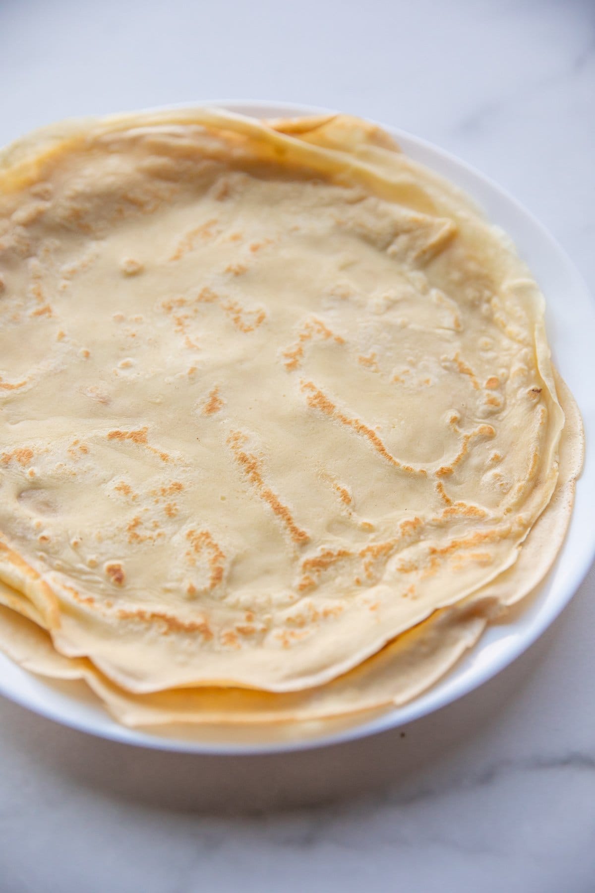 cooked crepes on plate