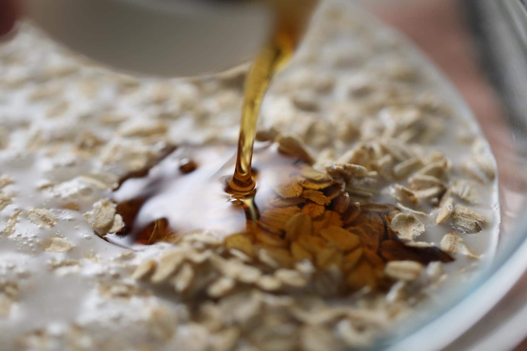 maple syrup poured over rolled oats