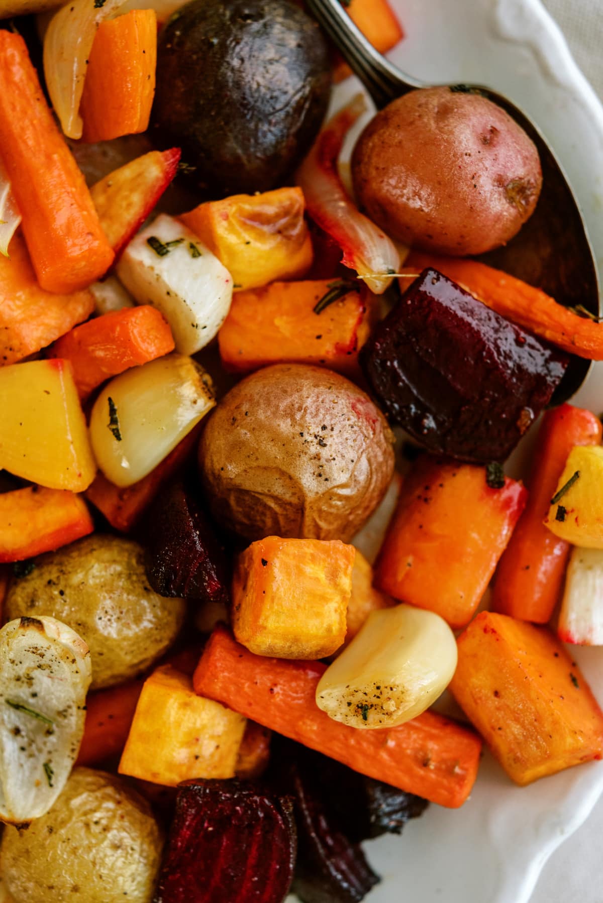cooked roasted root vegetables on platter