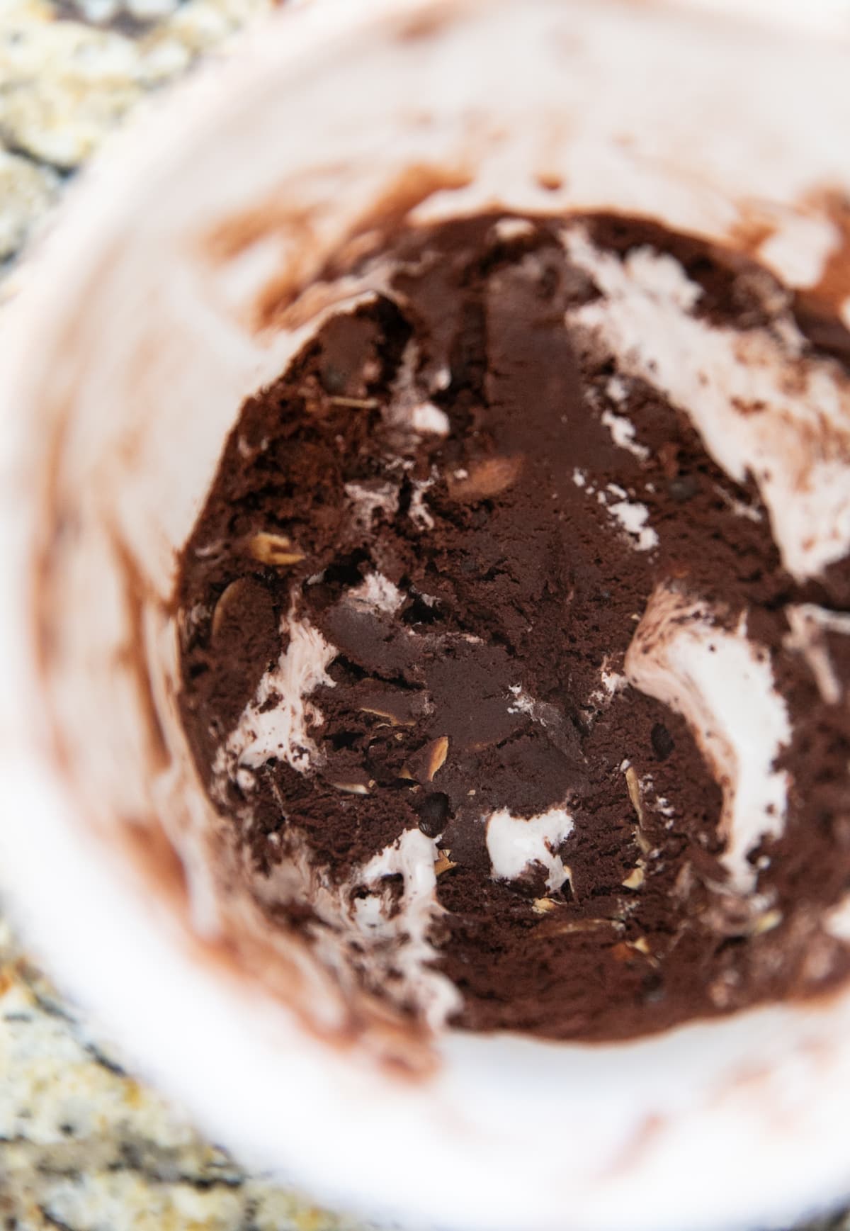 rocky road ice cream frozen in a plastic container