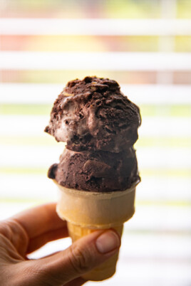 two scoops of rocky road ice cream in an ice cream cone