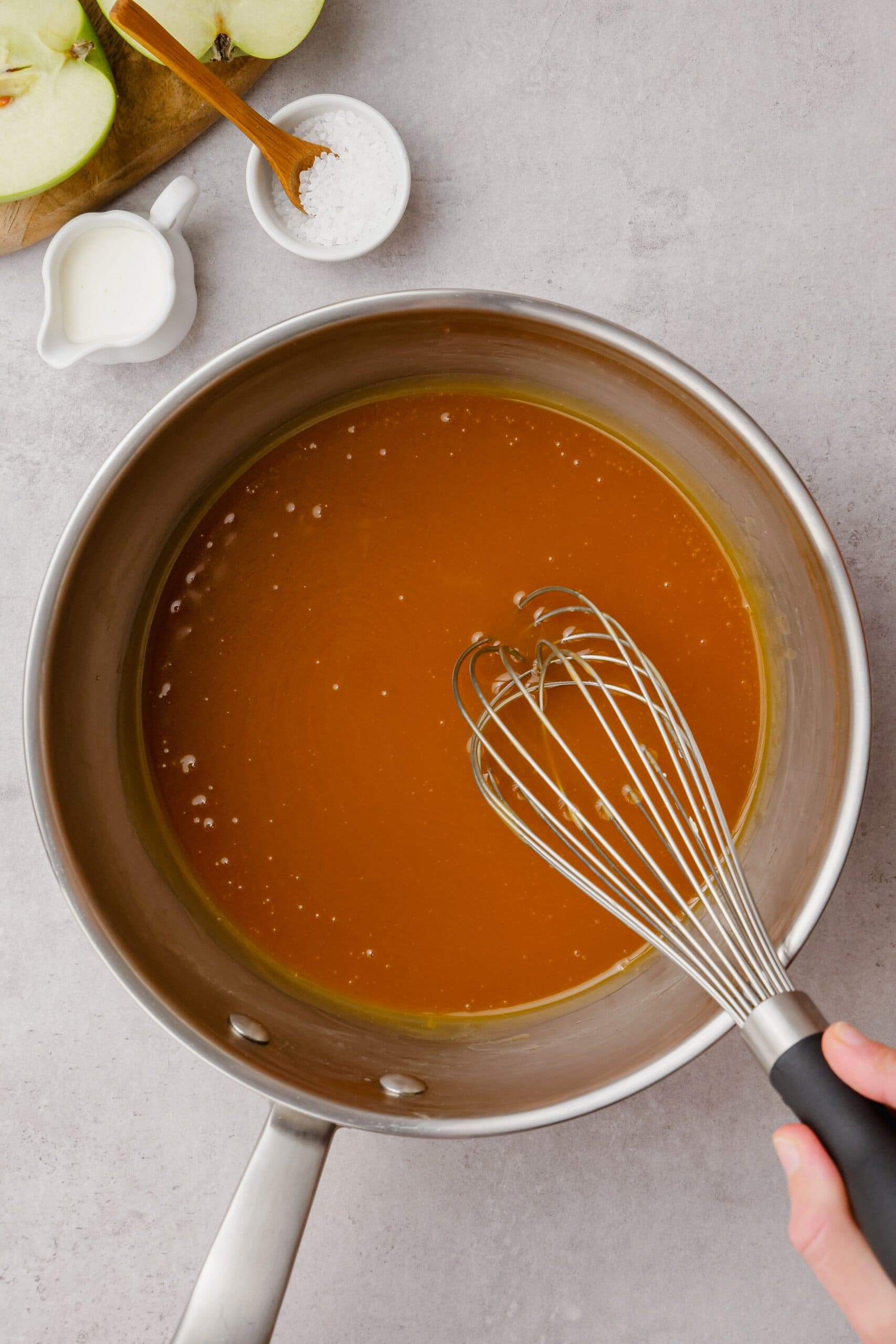 salted caramel in a pot with a whisk