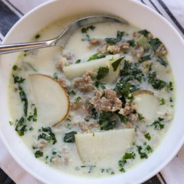 sausage kale soup in white bowl