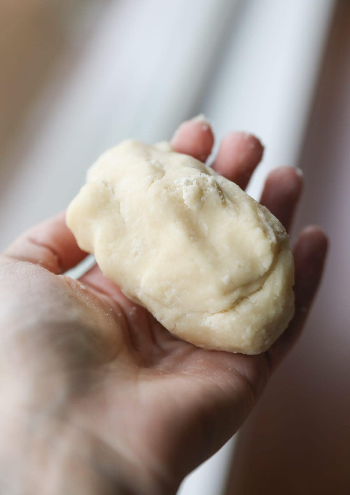 hand holding shortbread dough