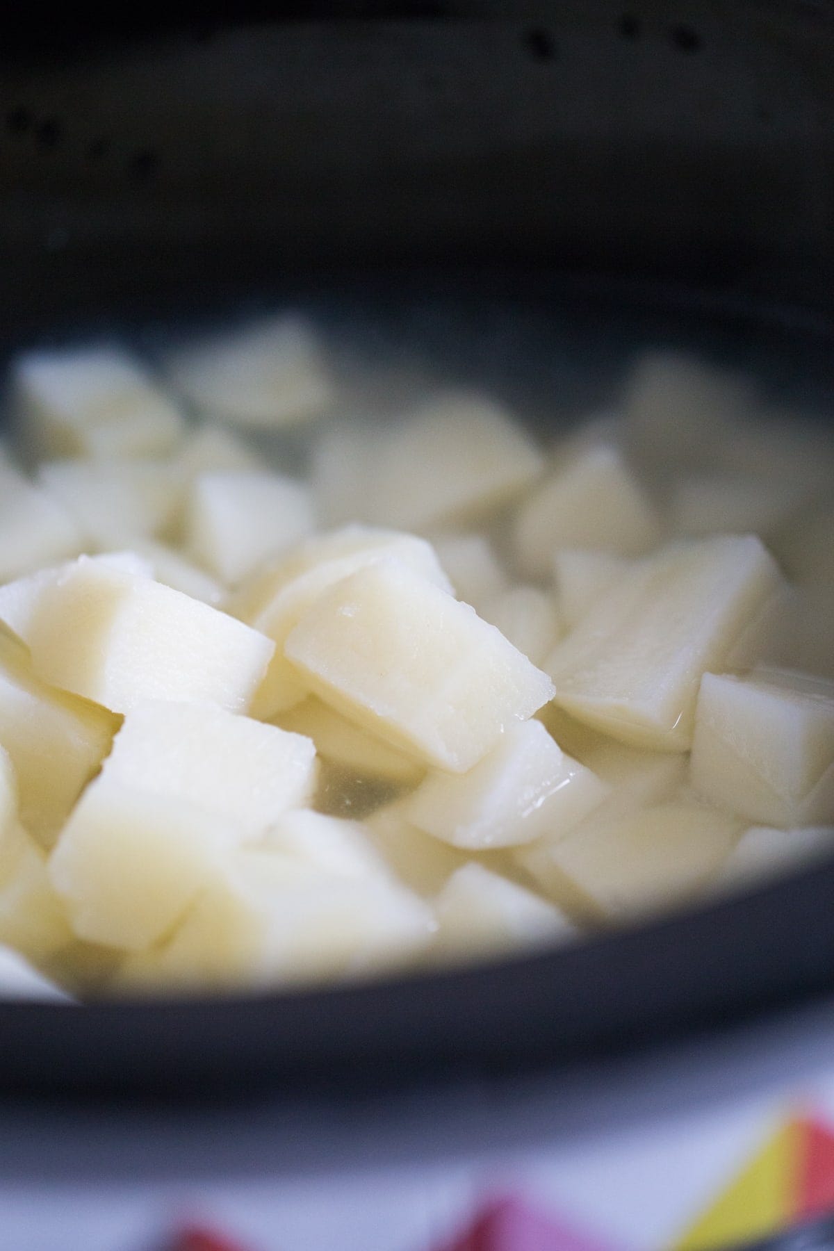Cooked diced potatoes in a slow cooker