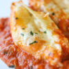 close up stuffed shells with sauce
