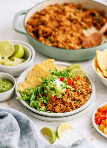 taco rice on plate with chips and toppings
