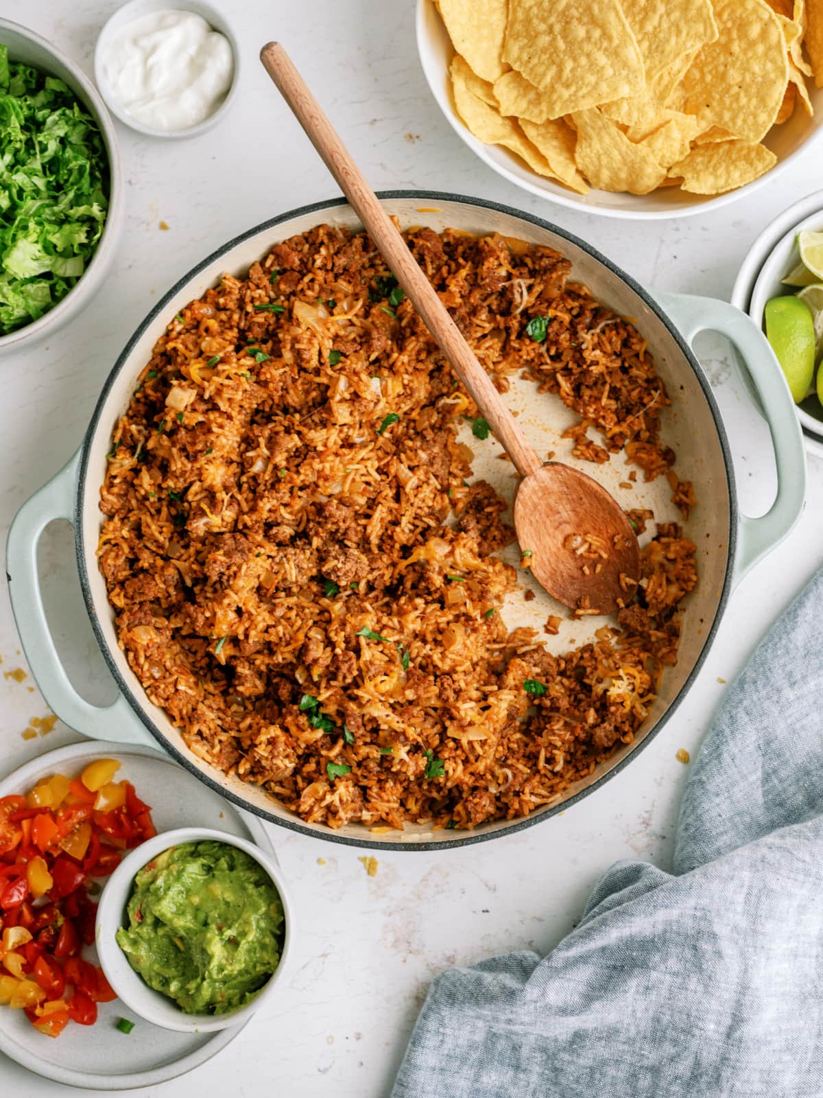 taco rice in pot with wooden spoon
