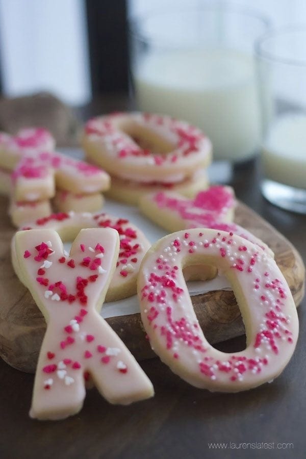 Valentine Sugar Cookies on a wooden  cutting board
